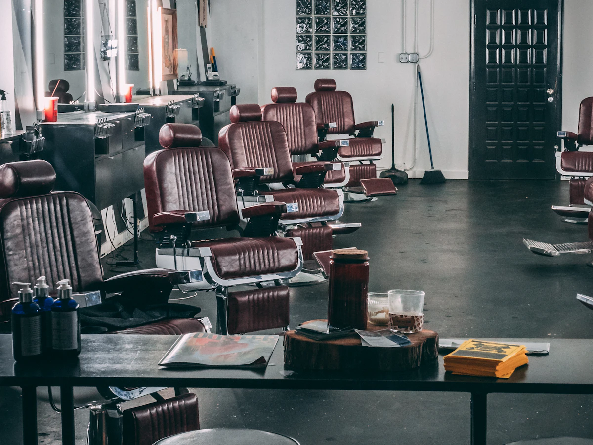 Leather barber chairs and mirrors in an empty barber shop